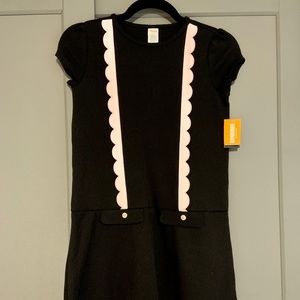 Black drop waist dress with pale pink trim